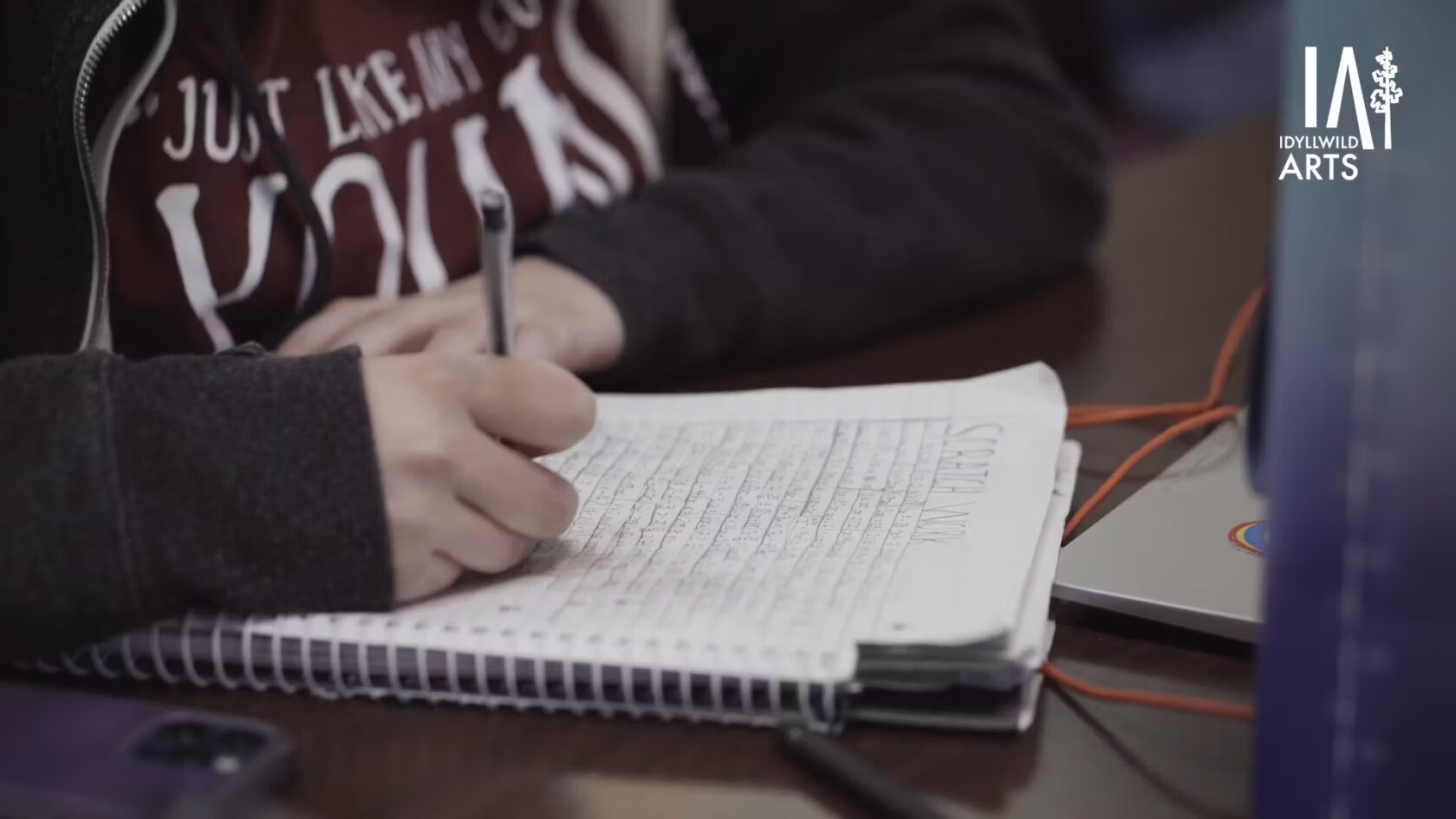 A student taking notes.