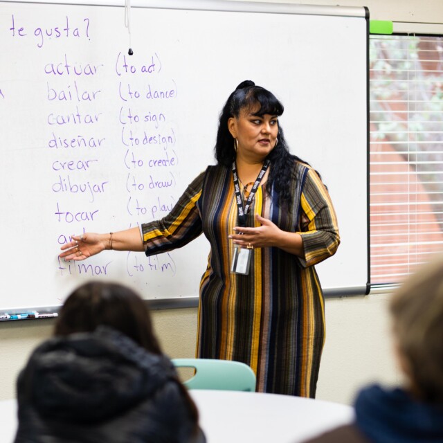 A faculty member teaching a Spanish class.